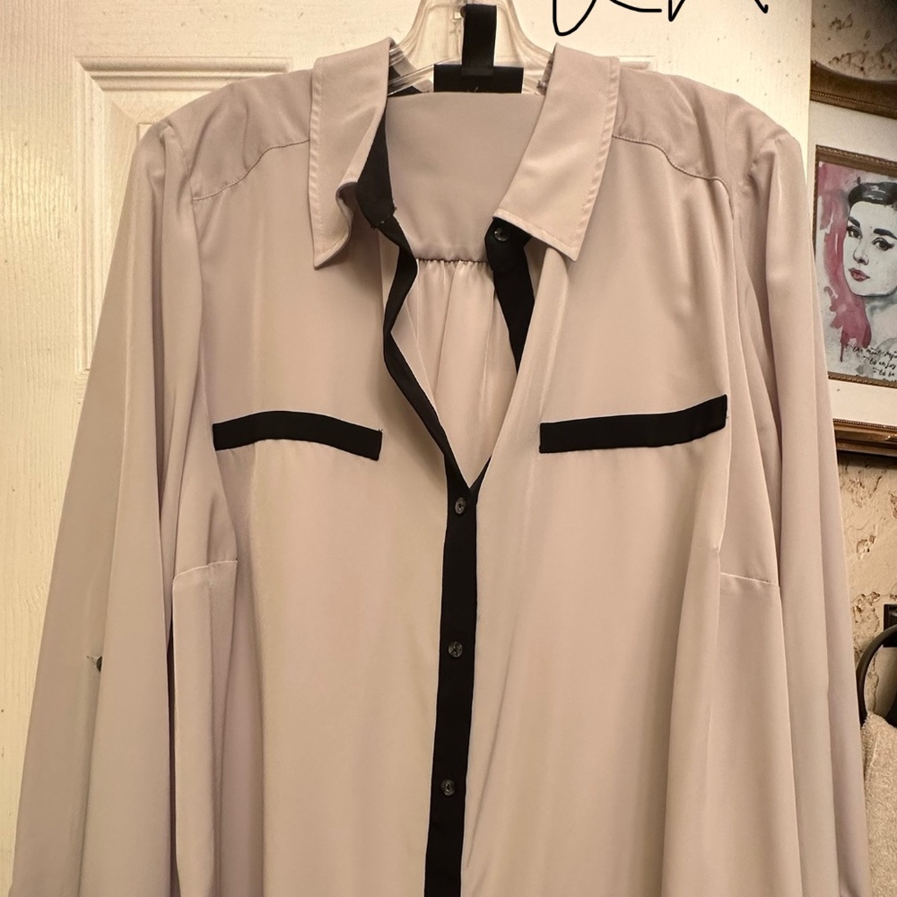 A silk like feel professional dressy top in black and khaki in color
